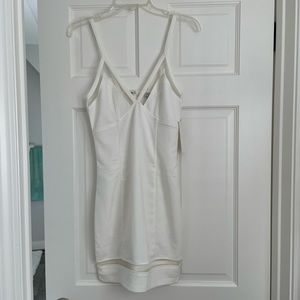 White mini dress with mesh accents